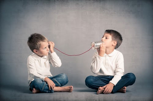 children with tin can telephone